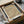 Abstract print in cream and tan hues displaying introspective Bauhaus aesthetic with rhythmic mark-making and minimalist compositional approach.
