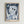 Framed Bauhaus poster of Klee's otherworldly angel figure rendered in soft cream and pale blue against dark gray, capturing the artist's characteristic modernist style and dreamlike sensibility.