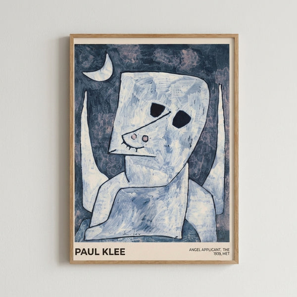 Framed Bauhaus poster of Klee's otherworldly angel figure rendered in soft cream and pale blue against dark gray, capturing the artist's characteristic modernist style and dreamlike sensibility.