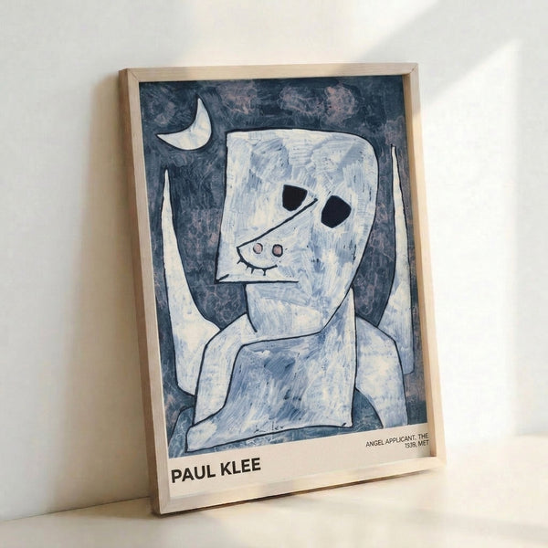 Paul Klee Angel Applicant modern art print in muted whites and blues, displaying an abstracted angelic form with lunar imagery in the artist's distinctive minimalist Bauhaus aesthetic.