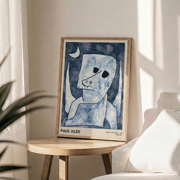 Wabi sabi-inspired Bauhaus artwork by Paul Klee showing an angelic figure amid lunar elements in a restrained palette of cream, pale blue, and charcoal gray.