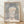 Paul Klee's Athlete's Head, a geometric abstraction featuring an angular faceless portrait in cream, grey-blue, salmon-pink, and olive tones, framed on a wall.