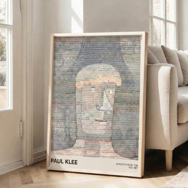 Geometric portrait study with salmon-pink and olive-green accents on a cream ground, capturing the modernist abstraction of Klee's 1932 Athlete's Head.