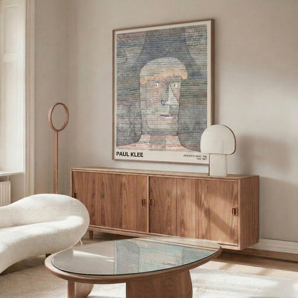 Klee's abstracted athlete portrait rendered in soft cream and grey-blue with geometric precision, a modernist take on figurative form now hanging framed.