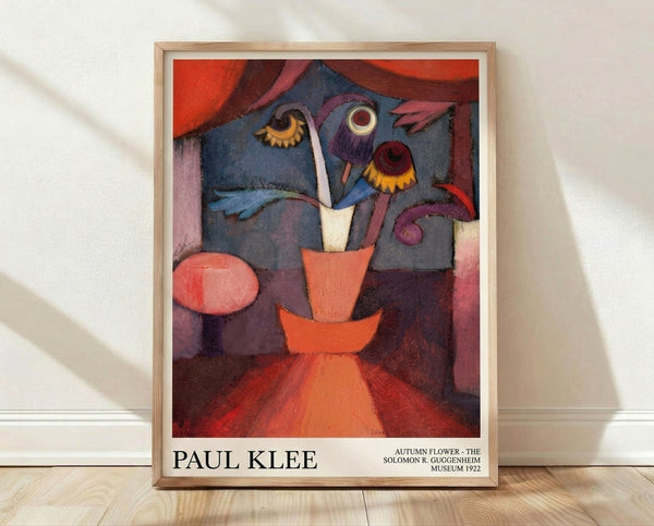 Abstract Bauhaus flower composition in rust orange, deep blue, and ochre yellow tones featuring a stylized vase with whimsical botanical forms, framed poster art print.