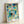Paul Klee's 1926 abstract house artwork displayed as a framed print, showcasing layered geometric elements in tranquil teal and cream hues.