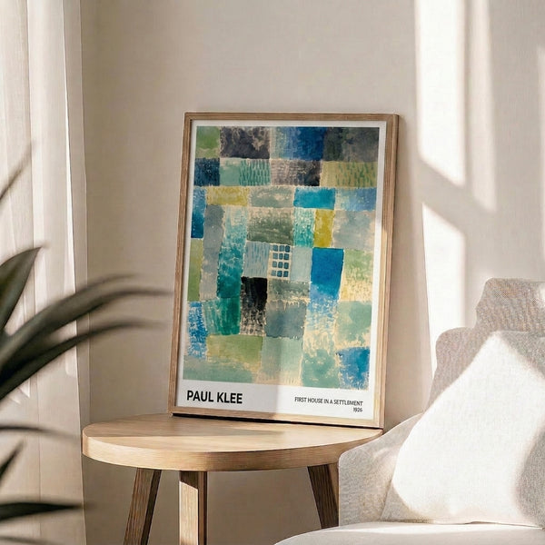 Framed contemporary art print of Klee's contemplative First House design, rendered in a minimalist palette of soft teal, cream, and muted greens.