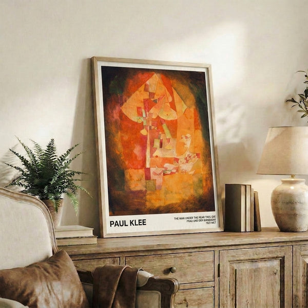 Framed abstract poster of a solitary figure beneath a pear tree, combining Bauhaus principles with warm orange, red, and ochre palette for a contemplative mood.