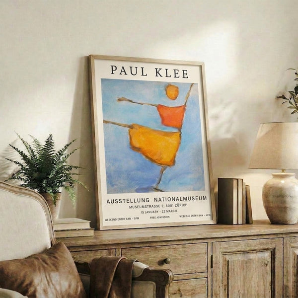 Minimalist poster art with a stylized figure holding a stick beneath a golden sun, combining Bauhaus design principles with warm and cool tones.