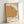 Minimalist wall art print of a geometric face in muted ochre and cream, reflecting Paul Klee's 1934 Bauhaus approach to abstraction.
