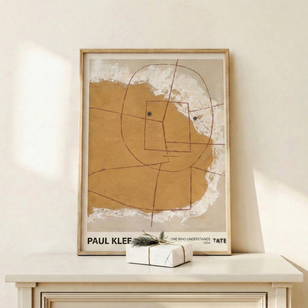 Paul Klee's One Who Understands: a geometric head portrait in burnt sienna and tan, rendered in the artist's distinctive Bauhaus minimalist style.