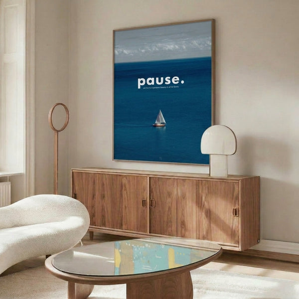 Minimalist ocean poster featuring a sailboat silhouetted against serene sky, combining teal, gray, and cream hues for aspirational coastal wall art.