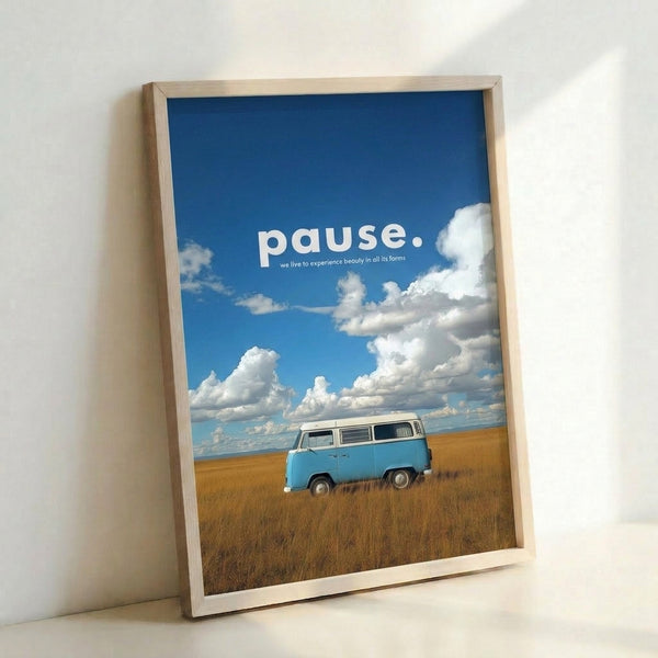 Framed minimalist poster depicting a vintage VW van set against rolling golden fields and a tranquil blue sky, ideal for contemplative spaces.