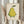 Japandi-style art print featuring a whimsical sleeping pear with serene expression, painted in muted palette of pale yellow, sage green, and cream with minimalist botanical leaf accents.