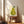 Cheerful pear art print in muted cream, yellow-green, and dark green hues, rendered in a serene minimalist style with whimsical personality.