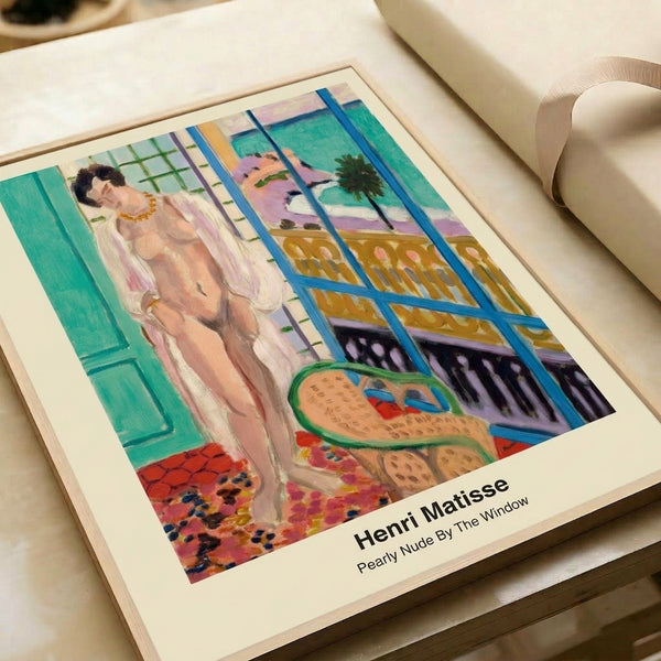 Modern minimalist framed art print showing an abstract female figure in cream and pastel hues near a window, conveying quiet elegance and contemplative serenity.