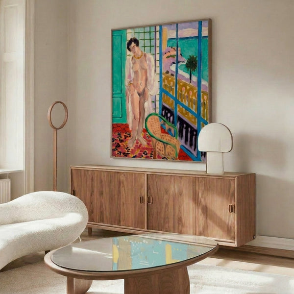 Soft palette abstract wall art combining cream, beige, and warm peach, depicting a figure in a contemplative pose with simplified geometric forms.