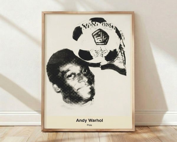 Bold pop art portrait of Pelé with a soccer ball in bright yellow, electric blue, and red, framed as a modern wall poster celebrating the legendary athlete.
