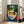 Vintage-inspired poster of a fragrant pho bowl garnished with vibrant herbs and red chili, rendered in art deco style with a cheerful palette of cream, deep green, and navy; retro restaurant-themed kitchen decor.