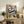 Creative wall art blending a grand piano, fresh flowers, and coffee imagery in retro style with terracotta, cream, and forest green accents.