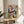 Framed poster celebrating music and creativity with line-drawn piano, floral details, and coffee cup motif in a palette of cobalt blue, ochre, and warm earth tones.