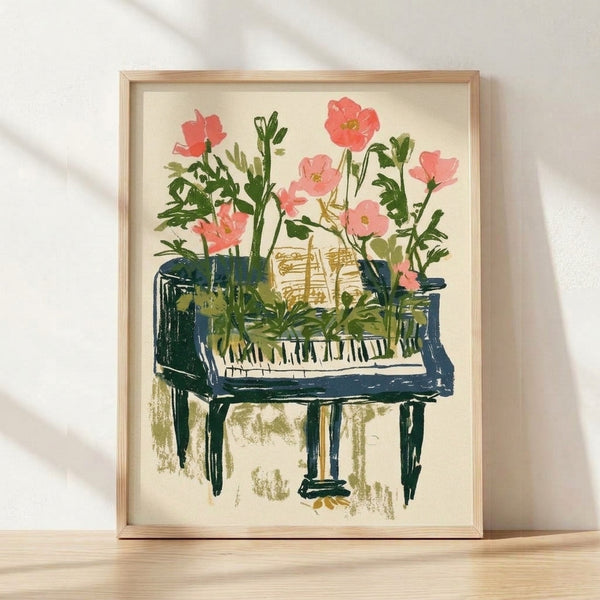Watercolor poster of a piano surrounded by blooming flowers and lush foliage in coral pink, forest green, and navy blue tones on a cream background, framed on a wall.