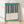 Minimalist line drawing of piano keys in slate blue and cream, framed on a wall as a sophisticated mid-century modern art print.