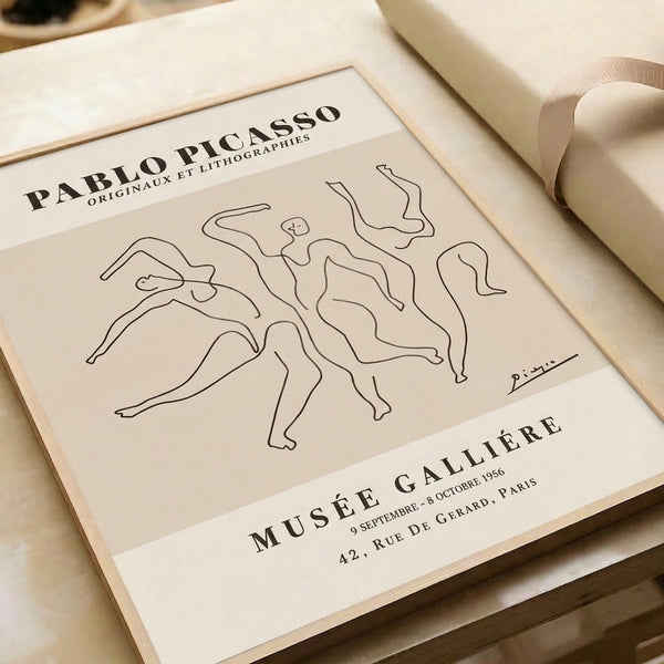 Framed black line drawing of a graceful abstracted human form, cream background, understated modernist approach to capturing dynamic movement.
