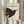 Contemporary minimalist wall art showing a graceful dove with olive branch in black line drawing on off-white ground.
