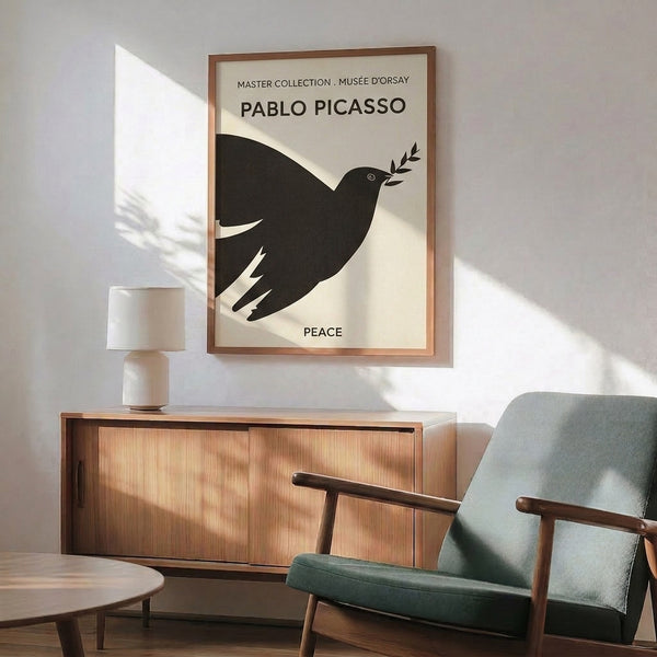 Framed poster featuring a serene black dove outline carrying an olive branch against a cream-colored background in modern minimalist style.
