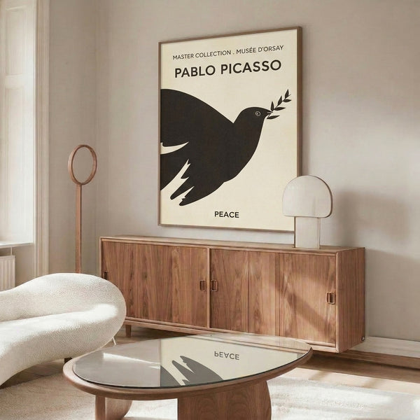 Modern line art framed print of a dove in flight with olive branch, rendered in simple black strokes on cream for peaceful wall decor.