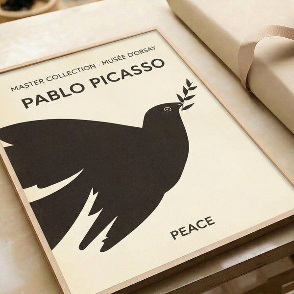 Cream background framed poster with a minimalist black line drawing of Picasso's peace dove and olive branch in contemporary style.