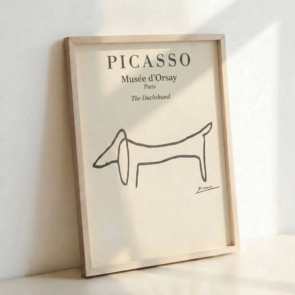 Single-line continuous drawing of a long-bodied dachshund dog in black ink on cream, minimalist framed poster with sophisticated charm.