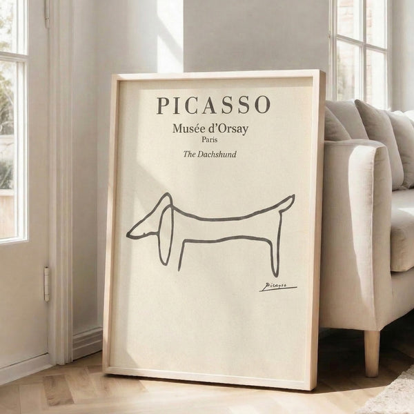 Charcoal line art dachshund portrait with playful character, cream background, framed print capturing elegant minimalism.