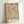 Ornamental botanical print showcasing pink and rose flowers with golden yellow stems and teal leaves in classic Art Nouveau design.