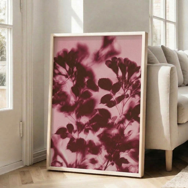 Minimalist watercolor artwork displaying graceful plant silhouettes in rose pink and mauve against a pale cream ground, evoking a contemplative, zen aesthetic.