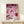 Coquette-style modern art print showcasing casino elements including cards, chips, a cocktail, and perfume bottle in rich pinks and deep purples, evoking playful nighttime sophistication.