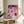 Trendy framed pop art poster with a woman's manicured hand amid glamorous casino imagery—cards, chips, champagne, and cigarette—rendered in luxe pink, burgundy, and cream tones.