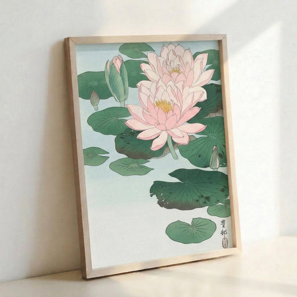 Japandi wall art showing a contemplative water lily composition with muted pink petals, pale and sage green leaves against cream, framed poster.