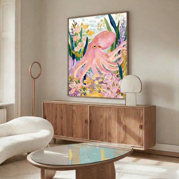 Soft watercolor framed art depicting a playful pink octopus surrounded by blooming flowers, delicate leaves, and clouds in a cheerful, boho-inspired composition with pastel colors.