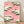 Serene Japanese woodblock-style poster featuring a pine tree, pink sky with soft clouds, and a bird in flight, rendered in forest green, pink, cream, and black tones.