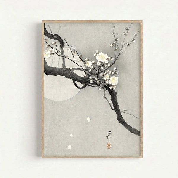 Framed Japandi art print depicting a graceful flowering branch with a luminous moon in the background, combining traditional woodblock aesthetics with contemporary zen simplicity.