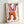 Abstract geometric poster in cream, black, pink and orange showing dynamic hand figures in playful tension, Bauhaus-inspired modern composition.