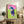 Pop art style framed poster with a pink polo subject popping against its bright green ground, displayed as wall art.
