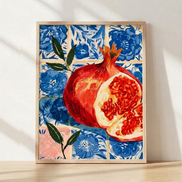 Watercolor pomegranate with leaves and blossoms rendered in warm reds and golds against deep blue tiles, framed botanical art print with bohemian aesthetic.