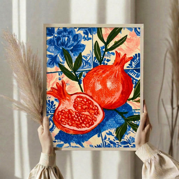 Vibrant retro fruit and flower wall art featuring a pomegranate with layered petals and verdant leaves in warm reds, pinks, and forest greens against a geometric blue and cream background.