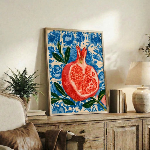 Art Nouveau-inspired watercolor composition featuring a ripe pomegranate with delicate pink blossoms and organic foliage against an ornate blue tiled wall.