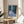 Luminous water lily scene in impressionist style featuring gentle blues and greens creating a tranquil, meditative mood on the wall.