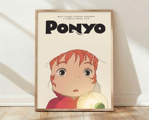 Whimsical Studio Ghibli poster featuring Ponyo, a magical girl character with coral-red hair and a curious expression, rendered in soft peach, cream, and moss green tones on a framed wall art print.
