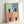 Quirky pop art black cat poster divided into four grid sections, each with cheerful sage, slate, rose, and peach colored backgrounds in a contemporary style.